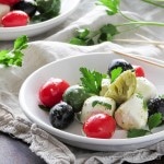 Caprese Salad with Olives & Marinated Artichoke Hearts is great for gatherings. | low carb, gluten-free, keto |lowcarbmaven.com