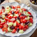 Mediterranean Cucumber Salad with tomatoes, red onion, kalamata olives, and feta cheese.