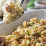 Creamy keto cauliflower mac and cheese casserole with bacon and ham.